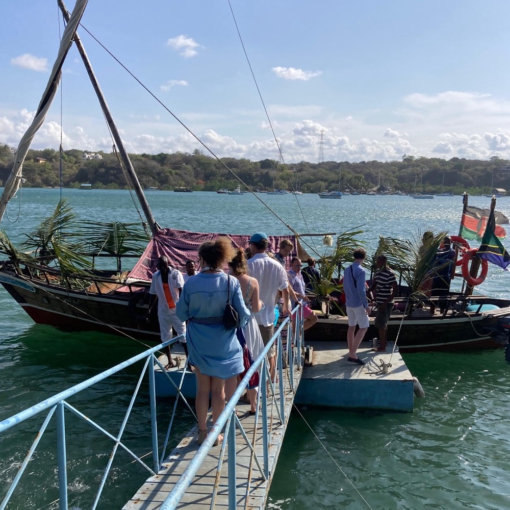 Guests boarding a dhow for an afternoon trip