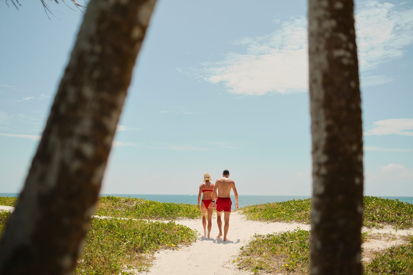 A couple walking the beach path at Bofa Beach