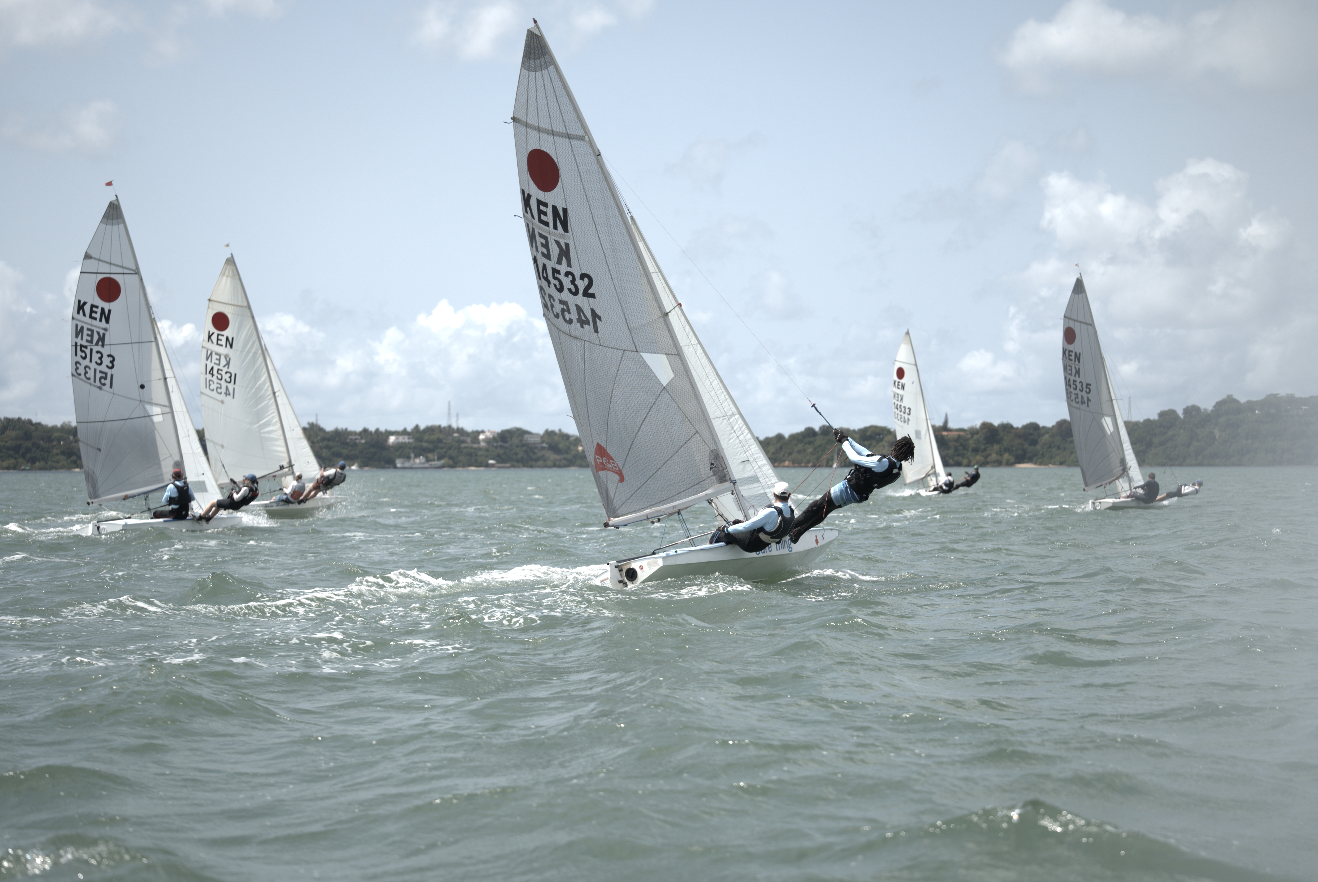 Fireball fleet racing upwind together off Kilifi Creek, KEN 14532 leading