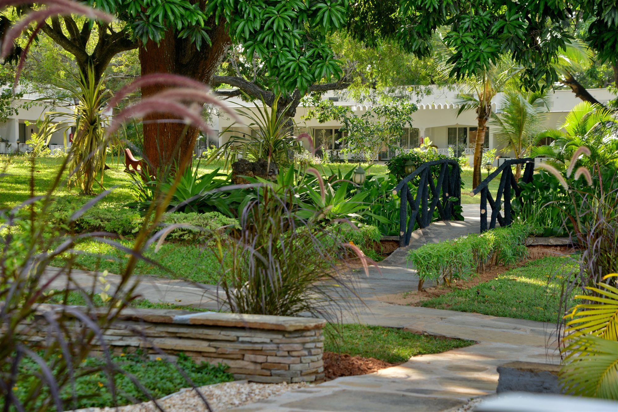 A Garden Room with standard double, twin and sleeper beds at Mnarani Beach Club