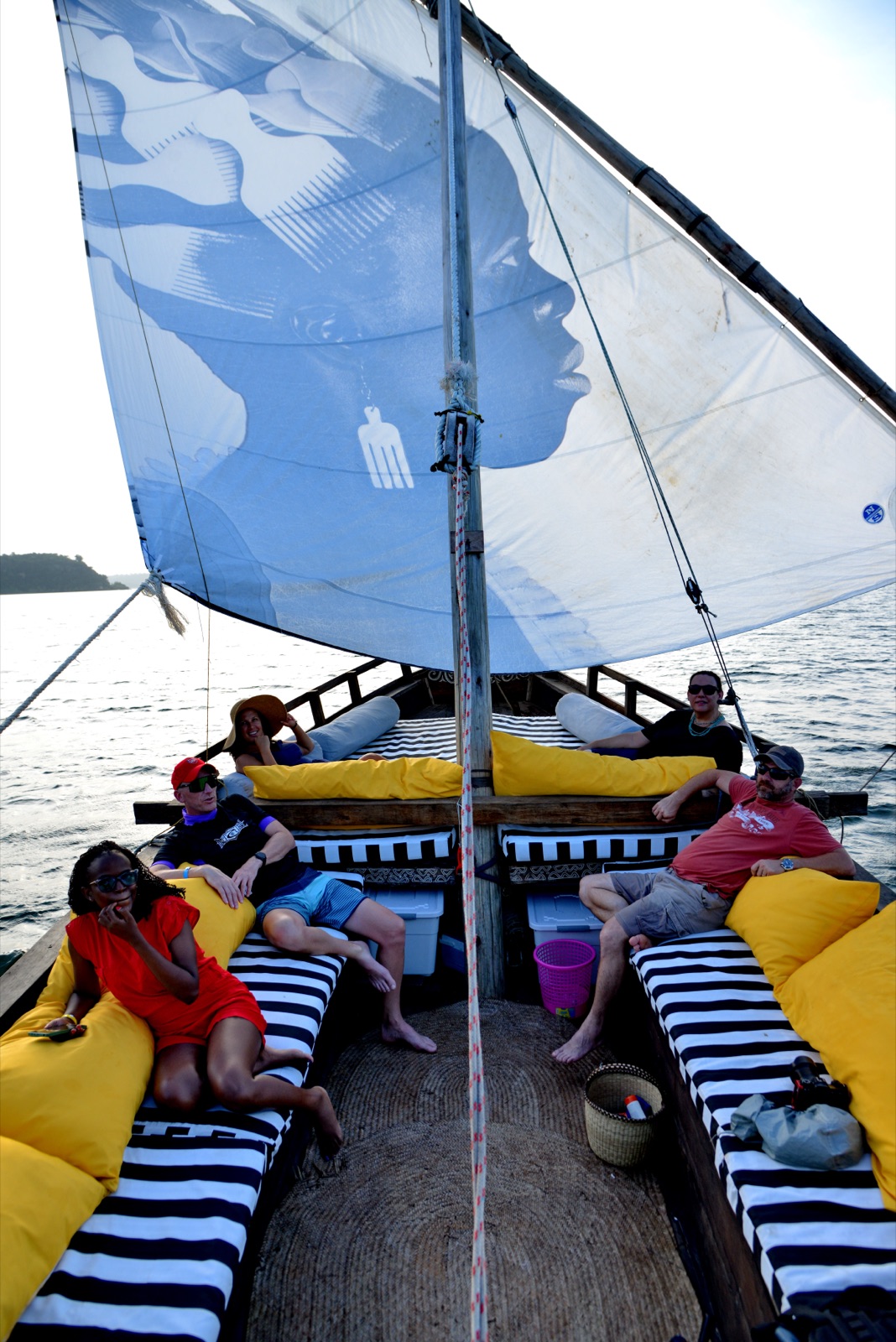 A traditional dhow sailing on Kilifi Creek at sunset